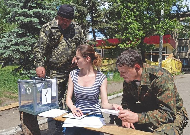 Pro-Russian fighters vote during an independence referendum at their position in the eastern Ukranian city of Slavyansk, yesterday.  Photo: AFP