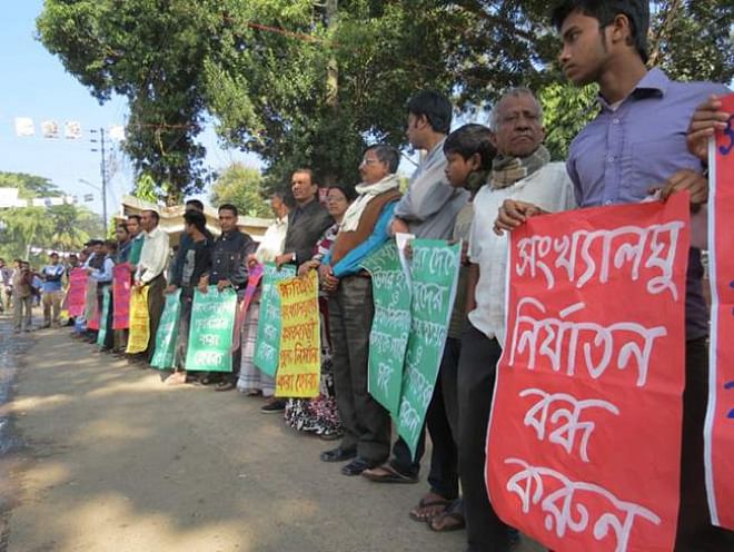 Different organisations in several districts yesterday stage protests against attacks on Hindus in Jessore and some other districts by BNP and Jamaat-Shibir men during and after the January 5 parliamentary elections. Photos show human chains in Rangpur. Photo: Star