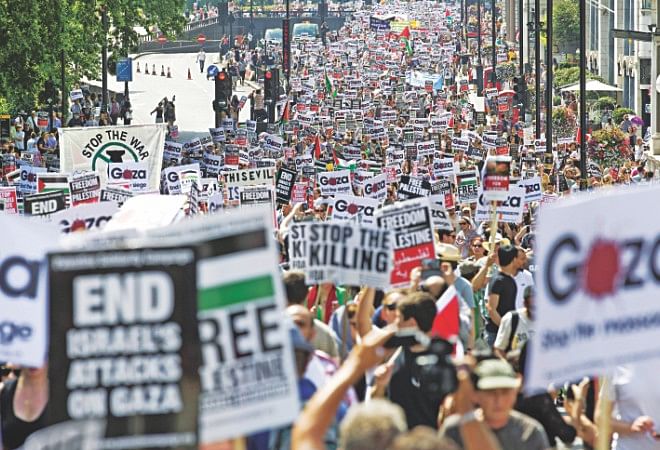 Around 10,000 demonstrators march through the streets of London yesterday calling for an end to violence in Gaza. Photo: AFP