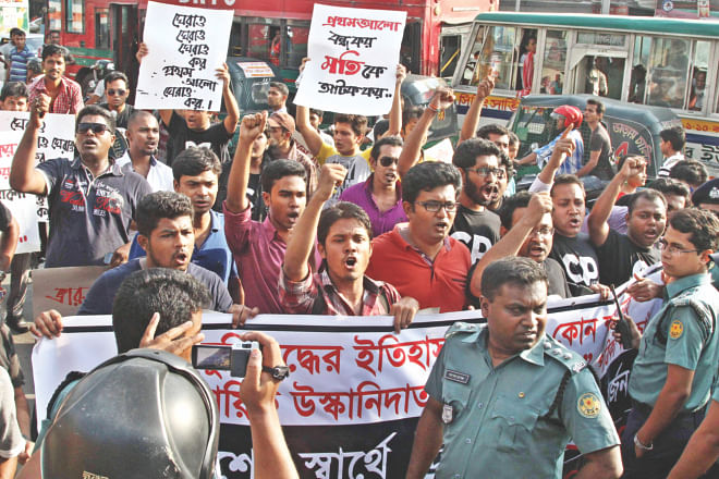 Members of Facebook group 'Crack Platoon Gang' demonstrating in front of Prothom Alo office at Karwan Bazar yesterday. They demanded the daily's publication be stopped and its editor be arrested for 