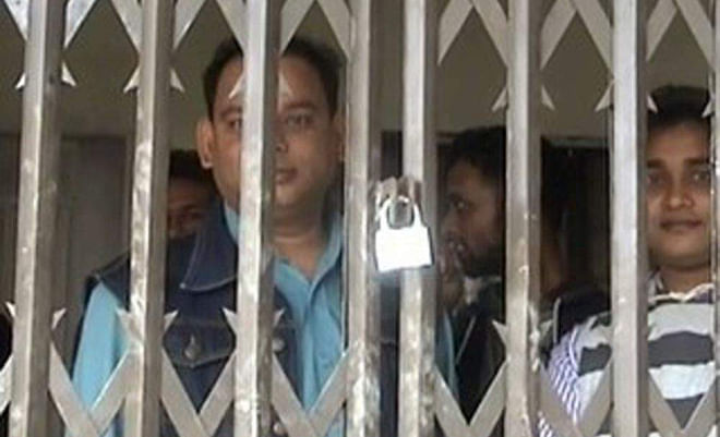  Officials and teachers of Pabna University of Science and Technology remain confined to the newly constructed administrative building for two hours yesterday as Chhatra League activists locked the main gate, being aggrieved for not inviting them to an informal function arranged by the officials before starting their work at the new building. PHOTO: STAR