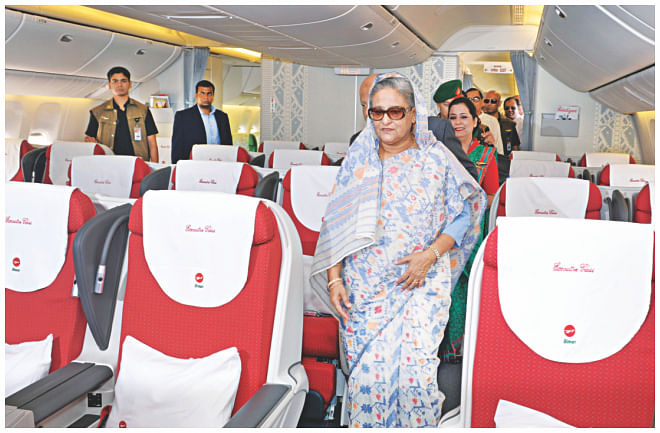  Prime Minister Sheikh Hasina takes a look inside the new aircraft.  . Photo: BSS