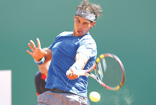 World number one Rafael Nadal of Spain plays a forehand return to Andreas Seppi of Italy during the Monte Carlo Masters in Monaco yesterday. PHOTO: AFP