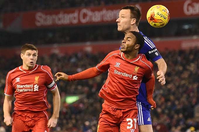 Liverpool's Raheem Sterling (R front) and Chelsea's John Terry (R back) during their League Cup match at Anfield on January 20, 2015. Photo: AFP