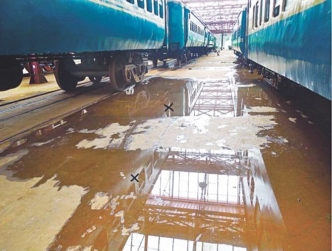 Rainwater seeps through the newly reconstructed roofs of several 'mini units' at Saidpur railway workshop. Photo shows two points of a unit where water trickles down its shed. PHOTO: STAR