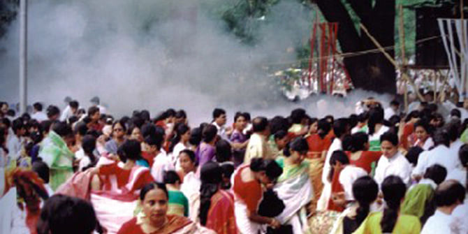 The photo taken on April 14, 2001 shows panic-stricken men, women and children running for cover (top) after the huge explosion at the Ramna Batamul during Bangla New Year celebrations that left nine killed and at least 50 others injured. 