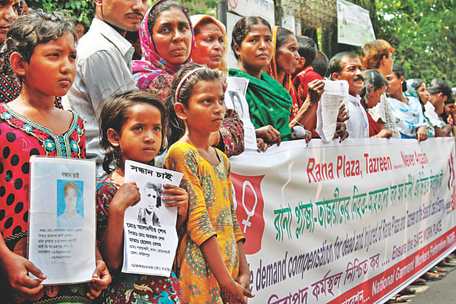 Family members of the victims of Rana Plaza collapse and Tazreen Factory fire form a form a human chain demanding quick compensation, in front of the National Press Club in Dhaka recently. Photo: Star/file
