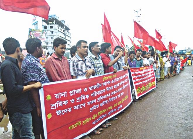 Survivors and families of those who died in the Rana Plaza collapse form a human chain at the site in Savar demanding compensation before Eid.  Photo: Star