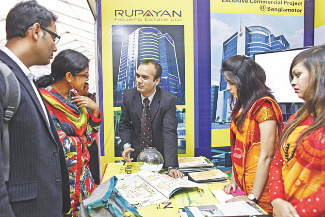 People visit a stall of Rupayan at the Real Estate and Housing Association of Bangladesh's five-day fair that began at Bangabandhu International Conference Centre in Dhaka yesterday.  Photo: Star 