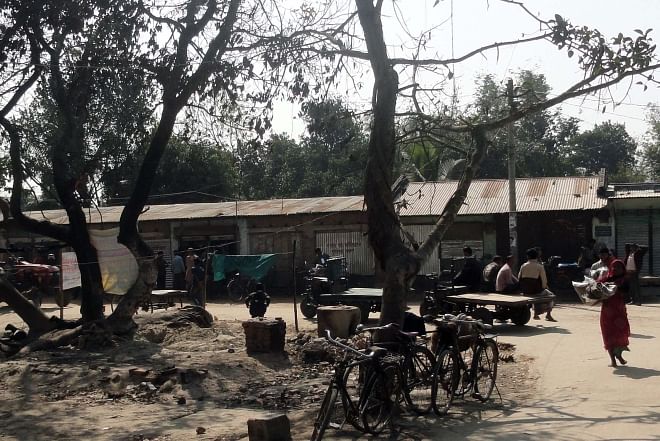Shops and houses of Hindus, damaged and torched by Jamaat-Shibir and BNP men at Kornai village in Sadar upazila of Dinajpur on the election day on January 5, were rebuilt and handed over to the owners yesterday. Photo: Star