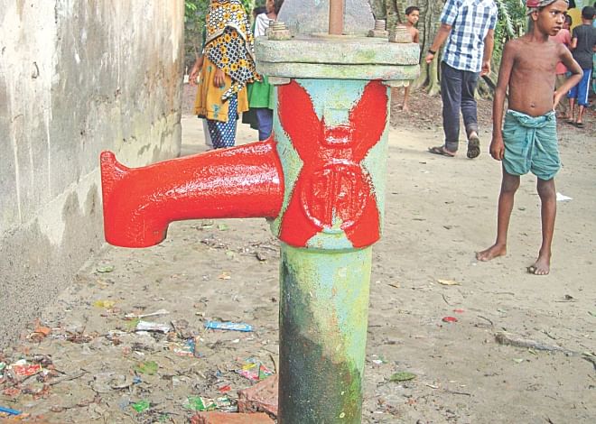 This red-marked tube-well on the premises of Kurighar Government Primary School in Nabinagar upazila under Brahmanbaria district is one of over 62 thousand arsenic contaminated water sources in the district. PHOTO: STAR
