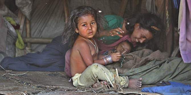 This Star file photo shows a family of Rohingya refugees inside their shanty in the Outer Stadium area of Chittagong city. 
