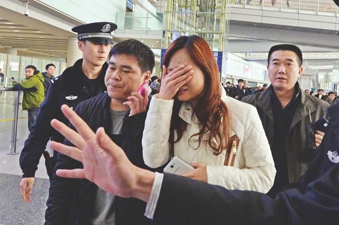 A relative cries at the Beijing Airport after news of the missing Malaysia Airlines Boeing 777-200 plane in Beijing, yesterday. Malaysia Airlines said a flight carrying 239 people from Kuala Lumpur to Beijing went missing early yesterday near the in the waters of southern Vietnam en routr to Beijing. All on board were presumed dead.  Photo: AFP