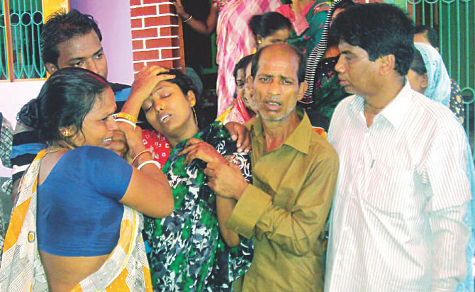 Relatives try to console Jyotsna Rani as she mourns 11 people killed in a bus-train collision in Jhenidah's Kaliganj on Friday. It was from her wedding that the victims were returning. Photo: Banglar Chokh