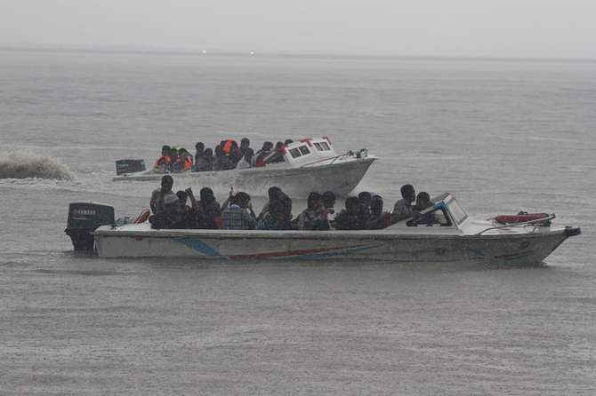 Rescue team members with speedboats are searching for missing victims in Pinak-6 launch capsize Wednesday afternoon. The launch with 200 passengers onboard sank in the Padma river of Lauhajang upazila in Munshiganj Monday. Photo: STAR