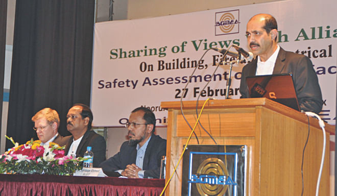 Atiqul Islam, president of Bangladesh Garment Manufacturers and Exporters Association, speaks at a meeting on building and fire safety with garment makers and representatives of Alliance for Bangladesh Worker Safety, at the BGMEA office yesterday. Wesley Wilson, senior director of ethical sourcing of Wal-Mart, was also present.   Photo: BGMEA