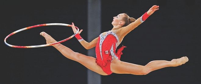 Patricia Bezzoubenko of Canada performs during her hoop routine in the rhythmic gymnastics individual apparatus final at the 2014 Commonwealth Games in Glasgow yesterday. The Canadian won gold in hoop, ball and clubs. Photo: Reuters