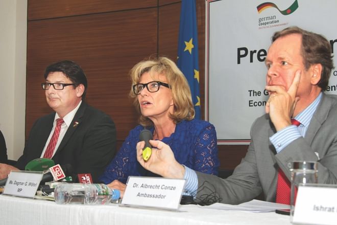 Middle, Dagmar G Woehrl, head of the German parliamentary delegation, speaks at a press briefing at German House in the capital yesterday. Stefan Rebmann, a German lawmaker and Albrecht Conze, German ambassador to Bangladesh, were also present. Photo: Star 
