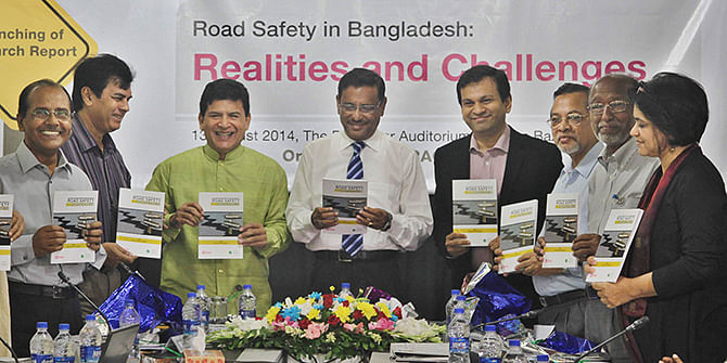 Communications Minister Obaidul Quader (fourth from left) at a programme on road safety at The Daily Star newspaper office in Dhaka today . Photo: Star