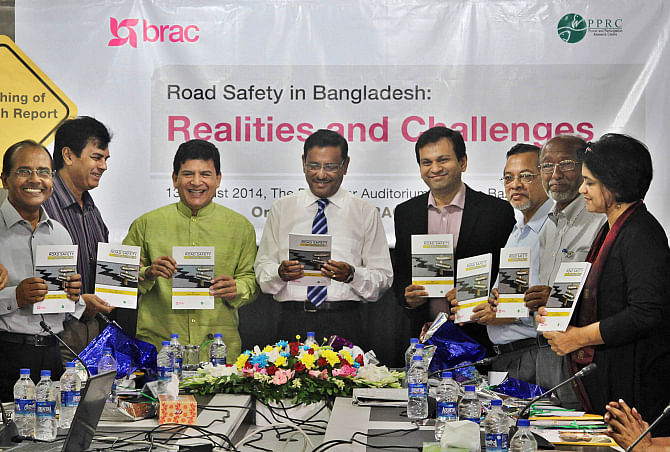 From left, Ahmed Najmul Hussain, Ilias Kanchan, Hossain Zillur Rahman, Obaidul Quader, Asif Saleh, Humayun Kabir Chowdhury, Abdul Haq, and Sara Hossain hold the copies of the research report, “Road Safety in Bangladesh: Realities and Challenges”, during its unveiling ceremony at The Daily Star Centre in the capital yesterday. Brac, and Power and Participation Reseach Centre (PPRC) conducted the study. Photo: Star