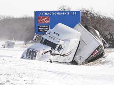 A semi truck sits in the ditch on the eastbound side of I-74 west of St Joseph, Illinois, on Monday amid sub zero temperatures. Photo: AFP
