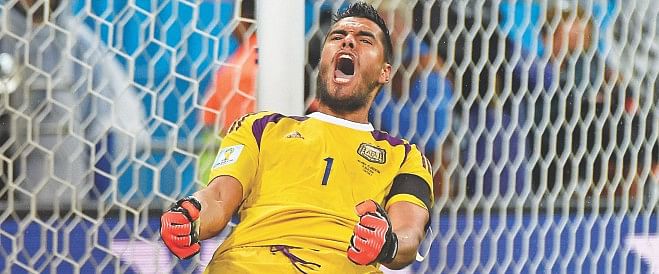 Argentina goalkeeper Sergio Romero's joy knows no bounds after saving a shot from Netherlands' Wesley Sneijder in the penalty shoot-out on Wednesday. PHOTO: AFP