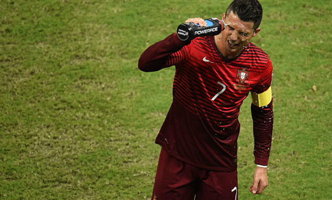 Portugal's forward Cristiano Ronaldo wets his face during a Group G football match between USA and Portugal at the Amazonia Arena in Manaus during the 2014 FIFA World Cup on June 22, 2014. Photo: Getty Images