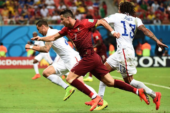 Cristiano Ronaldo (2nd R) chases the ball during a Group G match between USA and Portugal at the Amazonia Arena in Manaus during the 2014 FIFA World Cup on June 22, 2014. Photo: Getty Images