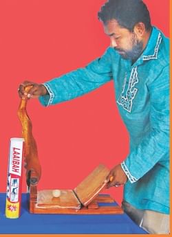 Inventor of the kitchen appliance, Humayun Kabir, demonstrating how to use Laaibah Roti Maker. Photo: Star