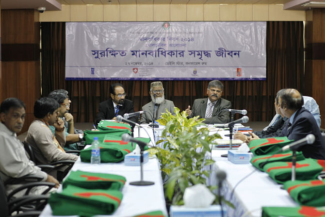 Participants at a roundtable titled “Surokkhito Manobadhikar Somriddho Jibon”, organised by National Human Rights Commission, at The Daily Star Centre in the capital yesterday, marking the upcoming Human Rights Day on December 10. Photo: Star