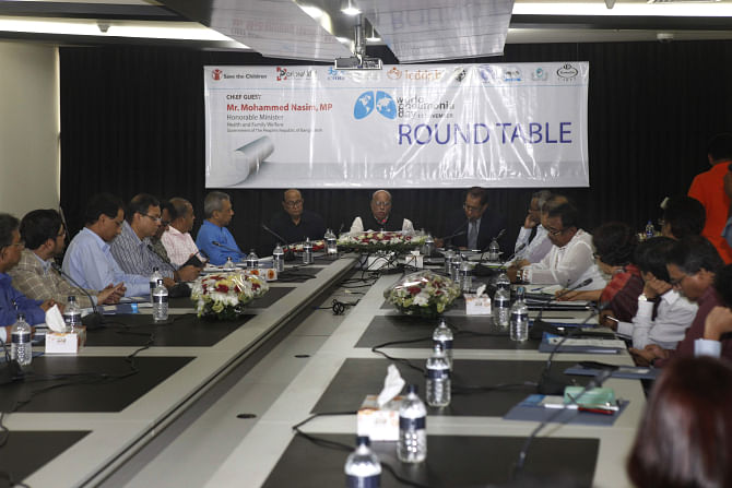 Participants at a roundtable discussion organised on the occasion of World Pneumonia Day by Poriprekkhit at The Daily Star Centre in the capital yesterday. Photo: Star