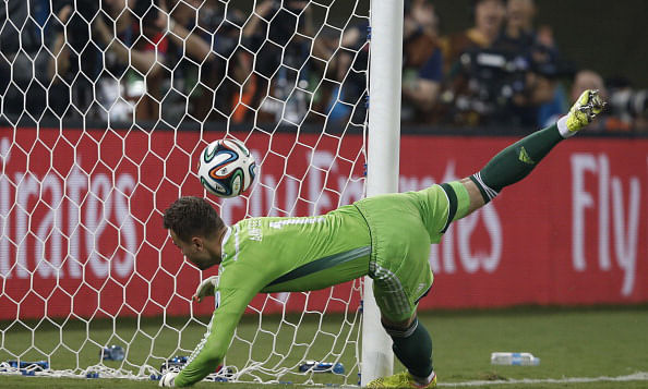 Russia's goalkeeper Igor Akinfeev fails to save the 0-1 goal during the Group H football match between Russia and South Korea in the Pantanal Arena in Cuiaba during the 2014 FIFA World Cup. Photo:AFP/Getty Images
