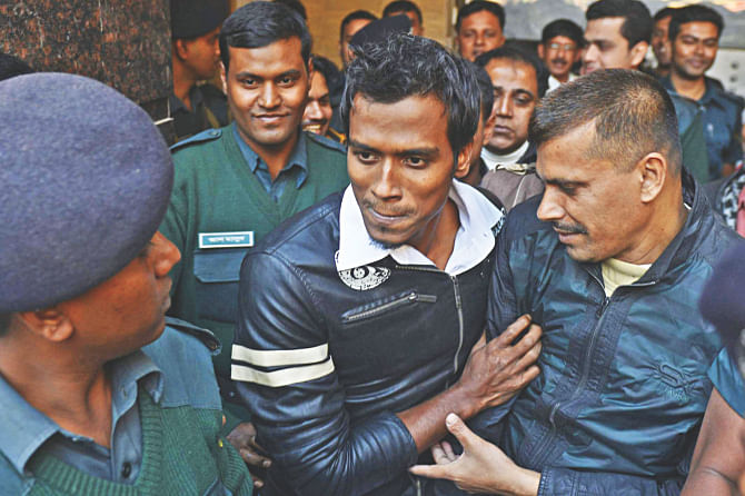 RUBEL HAPPY: Bangladesh pacer Rubel Hossain is escorted out of the Dhaka Central Jail after he was granted bail yesterday afternoon.  Photo: Star 