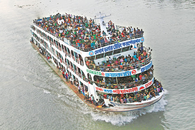 A launch leaves Dhaka with hundreds of people on board, eager to meet family members and spend the Eid holidays. The photo was taken from Postogola bridge on the river Buriganga yesterday. Photo: Amran Hossain