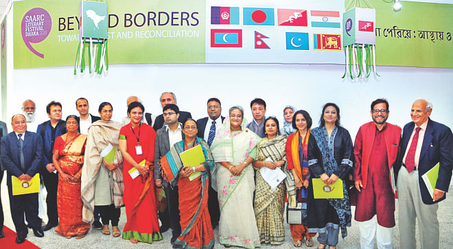 Prime Minister Sheikh Hasina with litterateurs of eight South Asian countries at the inaugural ceremony of Saarc Literary Festival Dhaka 2014 in the capital's National Museum auditorium yesterday. She inaugurated the two-day event as chief guest. Photo: BSS
