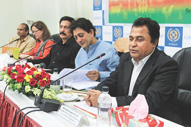 Planning Minister AHM Mustafa Kamal speaks at a seminar on social protection for food security organised by USAID-funded Shouhardo II programme of CARE Bangladesh, in Dhaka yesterday. Photo: Star 