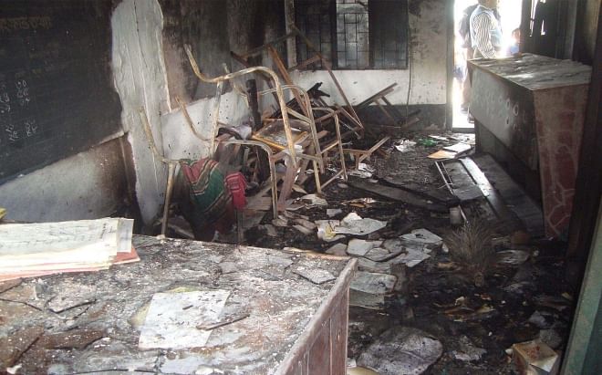The remains of the furniture of Mamunshia Govt Primary School in Kotchandpur of Jhenidah after criminals torched the school ahead of the January 5 polls. Photo: Star