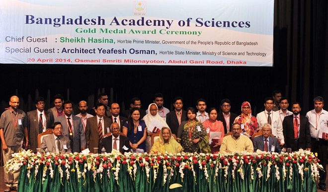 Prime Minister Sheikh Hasina with distinguished scientists who were awarded with gold medals for their contributions at a ceremony at Osmani Memorial Auditorium in the capital yesterday.  Photo: BSS