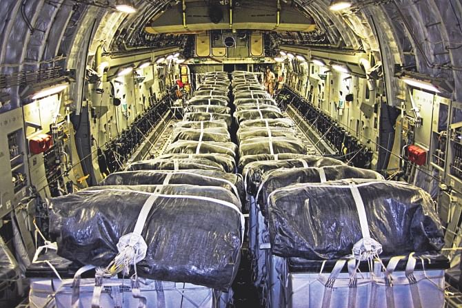 Straps secure water bundles aboard a C-17 Globemaster III before a humanitarian airdrop over Iraq. Photo: Afp, Ap