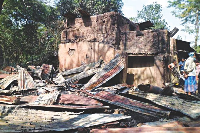 The home of a Hindu family at Muhuripara of Satkania in Chittagong yesterday after criminals burnt it to the ground.  Photo: Star