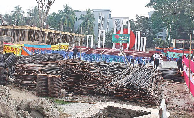 Bundles of rods, rubbles and other construction materials litter the premises of Central Shaheed Minar of Barisal, the cultural hub of the city dwellers, even on Victory Day today.  Photo: Star
