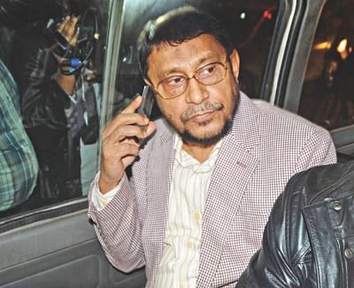 Detective Branch of police arrest BNP leader Shakhawat Hossain at Khaleda's Gulshan office last night and take him away on a microbus. Photo: Star
