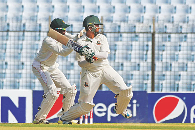 Ace Bangladesh all-rounder Shakib Al Hasan follows through on a back-footed cut during his fluent knock of 71 against Zimbabwe on the second day of the third and final Test at Chittagong yesterday. The Tigers piled up 503. In reply, the visitors were 113-1 at stumps.  PHOTO: ANURUP KANTI DAS