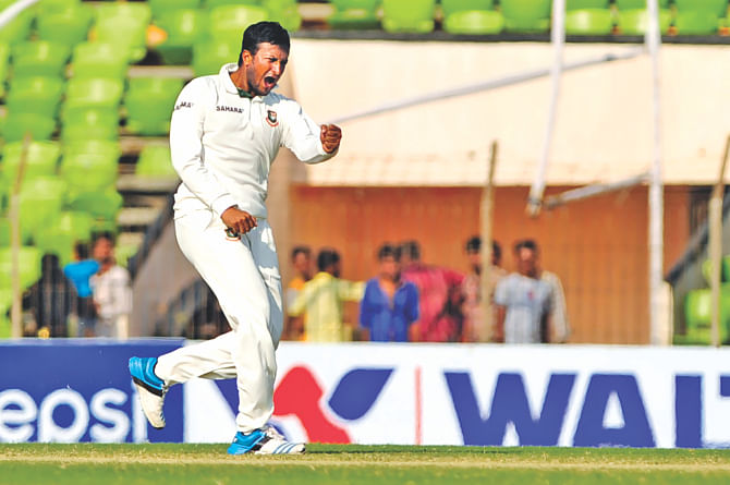Shakib Al Hasan becomes the third player after Ian Botham and Imran Khan to score a century and take ten wickets in a Test match on the fifth and final day at Sheikh Abu Naser Stadium in Khulna yesterday. Photo: FIROZ ahmed