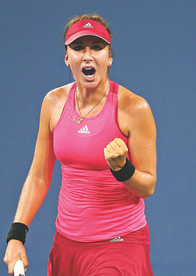 Youngest US Open quarterfinalist Belinda Bencic of Switzerland pumps her fist after beating former world number one Jelena Jankovic of Serbia at Flushing Meadows in New York on Sunday. PHOTO: AFP