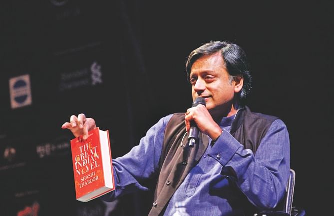Shashi Tharoor, Indian novelist and politician, showing his book The Great Indian Novel at the Hay Festival on Bangla Academy premises yesterday. Photo: Rashed Shumon