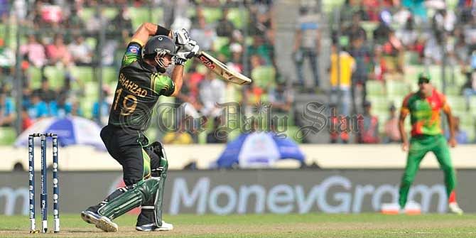 Pakistan opener Ahmed Shehzad drives a ball thru' cover against Bangladesh in World T20 match at Mirpur today. Photo: Firoz Ahmed