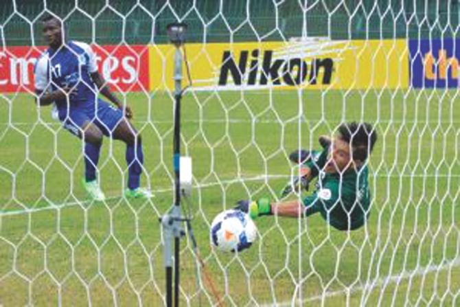 Sheikh Russel KC forward Nkwocha Kingsley watches his header beat FC Erichim goalkeeper at the Sugathadasa Stadium in Colombo yesterday. PHOTO: AFC.COM