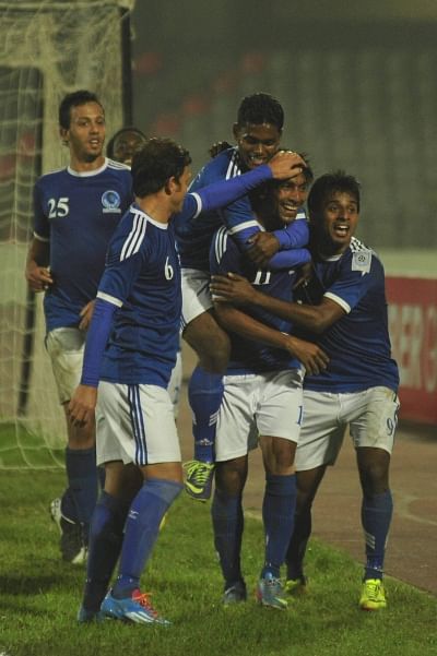 Sheikh Russel winger Shakil Ahmed (C) is the toast of his teammates after his goal gave them the lead in their Bangladesh Premier League match against Feni Soccer Club at the Bangabandhu National Stadium yesterday. PHOTO: STAR