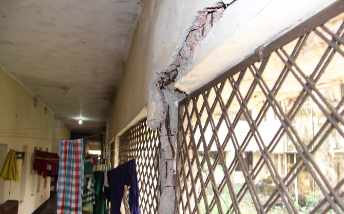 Dorm became risky with some portions of plaster from a pillar and the wall, falling down inside the building following construction of another five-storey dormitory too close to it. Photo: Arifur Rahman